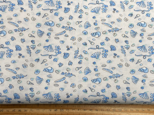 anita jeram clothworks sandy toes seaside sea puffins seagulls dog fish mxied mini shells grey blue fishes blue punch and judy cotton fabric shack malmesbury