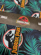 jurassic park opulent jungle cotton fabric dinosaurs dinosauria badges cream fabric shack malmesbury