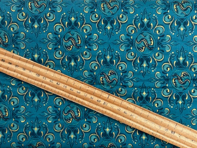 fire glow sarah watts ruby star society dragons badges seagrass teal metallic gold cotton fabric shack malmesbury