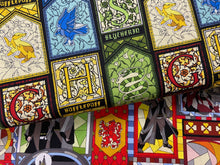 fabric shack sewing quilting sew fat quarter cotton patchwork quilt harry potter stained glass houses slytherin hufflepuff gryfindor gryffindor ravenclaw spell wizard