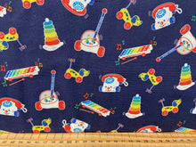fabric shack sewing quilting sew fat quarter cotton quilt patchwork mattel fisher price toys xylophone telephone hoops pull along dog frog crocodile tiger colours lion elephant navy blue white