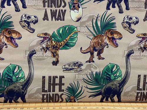 jurassic park opulent dinosaurs jungle cotton fabric life finds a way beige scatter fabric shack malmesbury